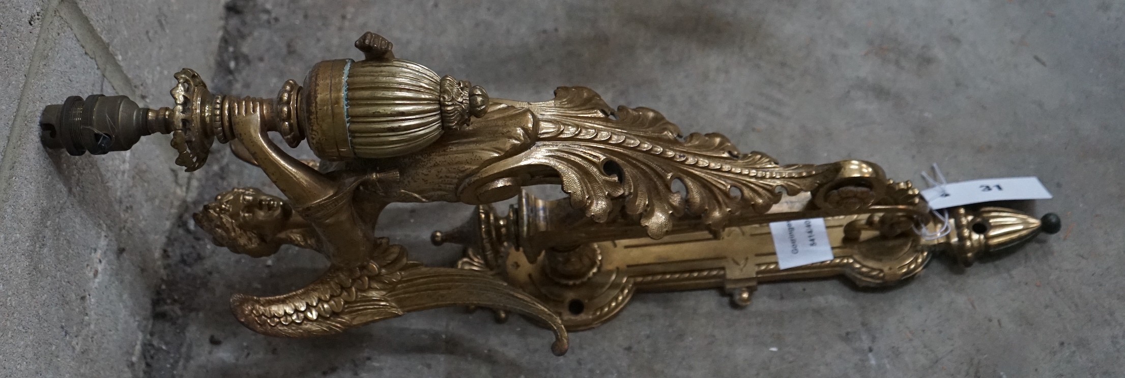 A brass single caryatid wall light, height 50cm